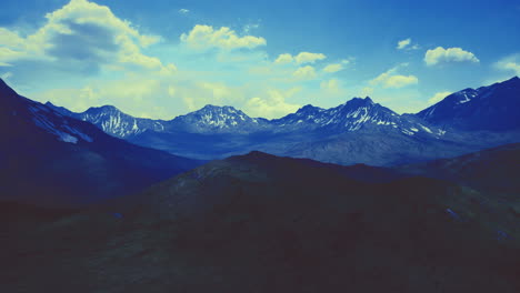 Majestic mountain landscape under a bright blue sky at golden hour