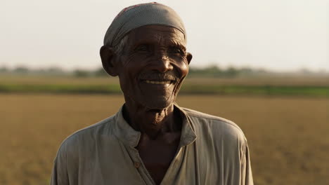 Portrait of a Smiling Elderly Man in a Field