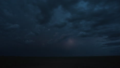 flashes of lightning from a powerful thunderstorm light up the night sky