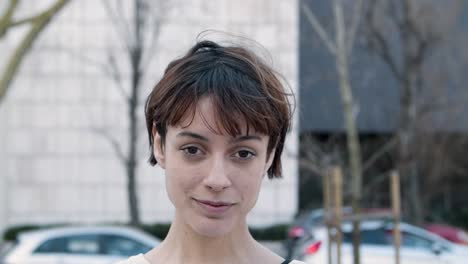 closeup view of cheerful young lady on street