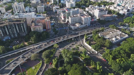an aerial video of chennai's mount road, anna salai flyover, in the morning would offer a breathtaking view of the city's bustling urban landscape. gemini flyover central business district of chennai