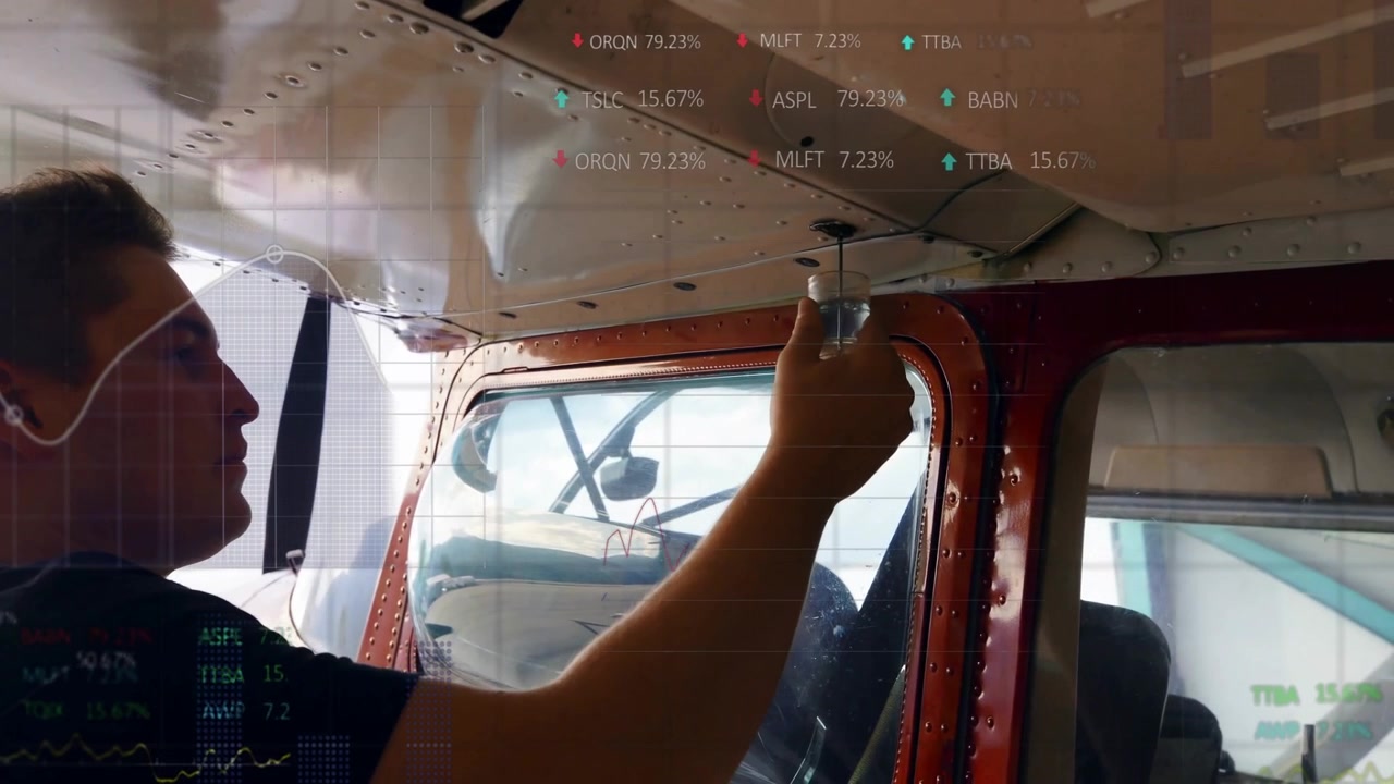 pilot removing glass dome overhead light in aircraft cabin, featuring animated stock ticker graphs