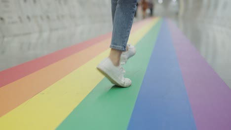 gen z gay joy fun walk low angle view with white sneaker and jeans.