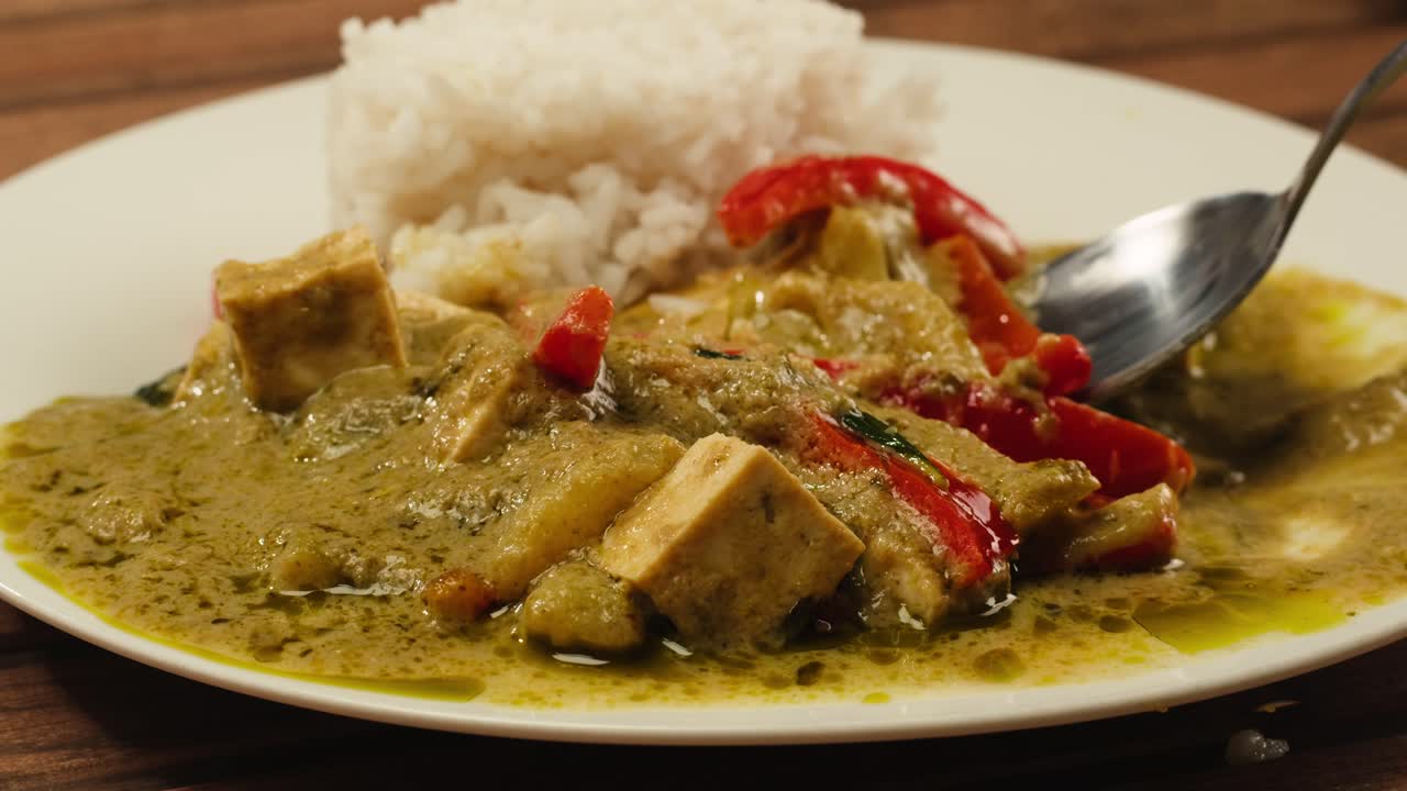 Close-up of Thai Green Curry with Tofu and Rice