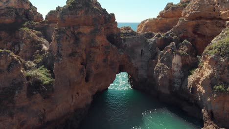 ponta da piedade cliffs and rocks against ocean water and horizon, algarve region, portugal