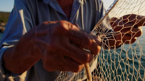 elderly fisherman on the coast