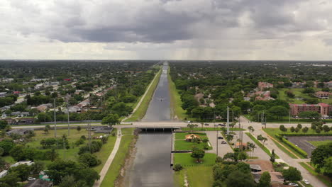 an aerial view of a long creek during the day