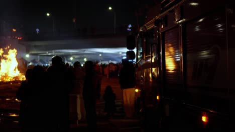 Korean-People-Watching-Buring-Fire-of-Daljip-Nori-on-Jeongwol-Daeboreum-Festival-Day-February-5-2023-at-Night-Ganganam-in-Seoul,-South-Korea