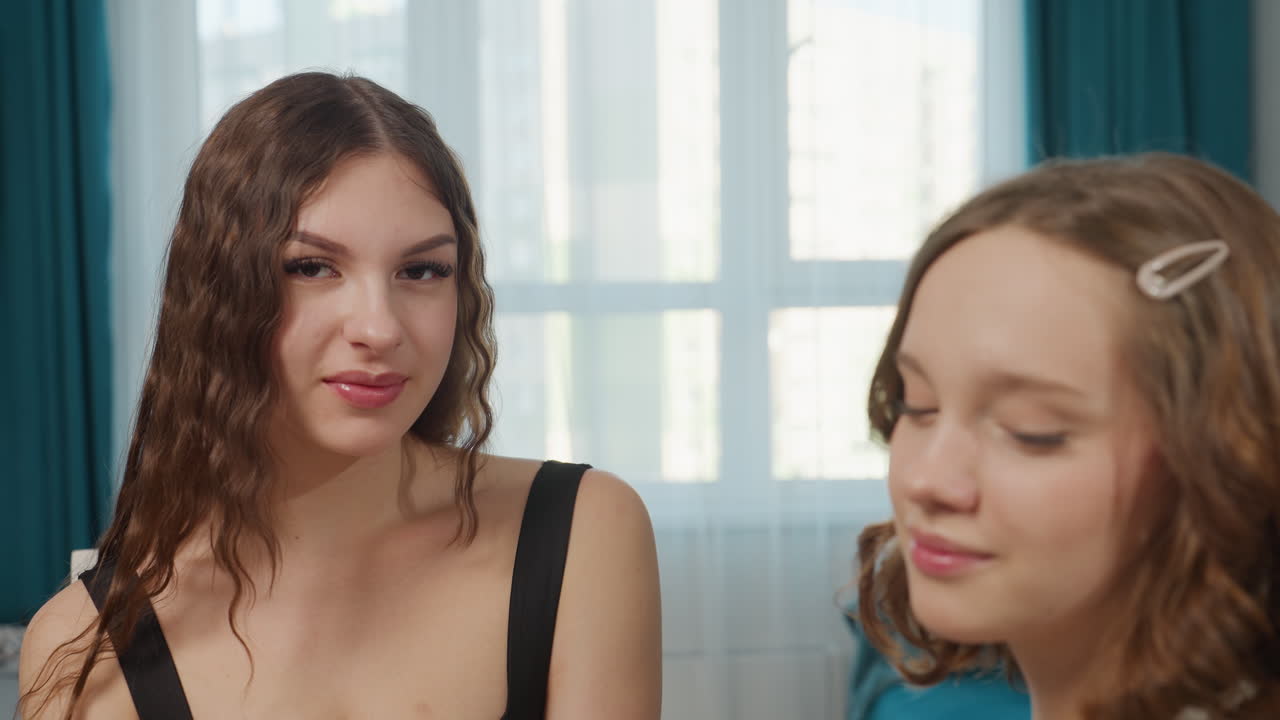 Casual Friends Sharing Warm Moment, Relaxed Pairs Seated Comfortably With Joyful Expressions, Pair Of Friends Sit Calmly On Sofa Chatting Happily With Gentle Eye Contact In Cozy Setting