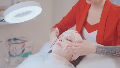 woman receiving a facial treatment at a beauty salon