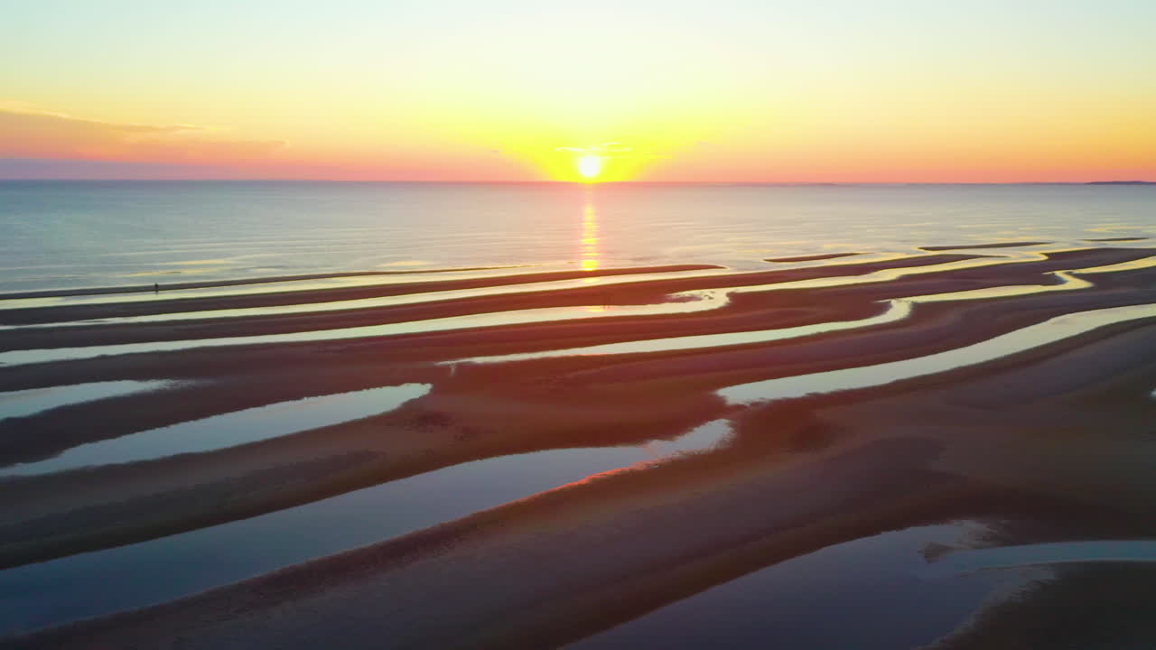 Cape Cod Bay Epic Sun Set Aerial Pan Right Drone Footage of Beach at Low Tide with People Walking, Sand Bars and Puddles