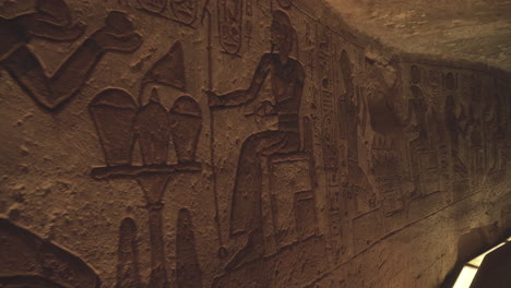 close shot of some hieroglyphs in a wall of the abu simbel temple in egypt