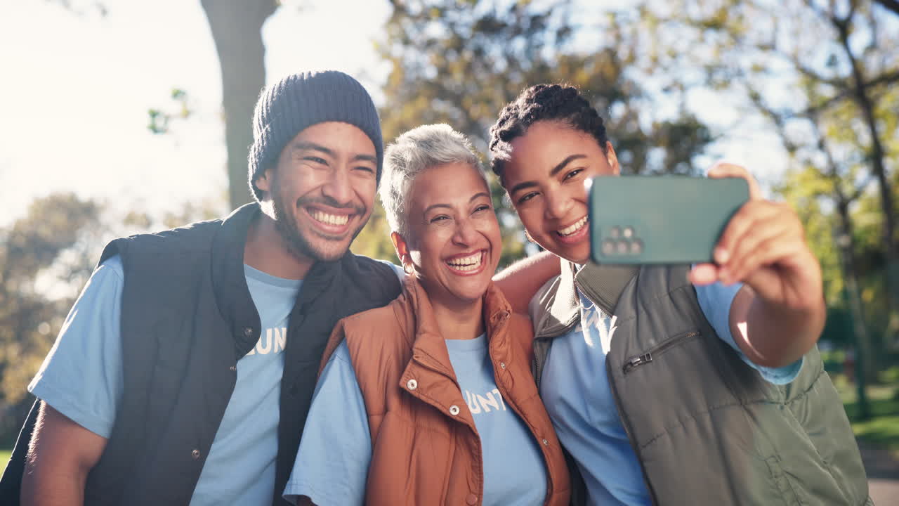 Group of volunteers taking a selfie in the park
