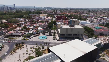 Flying-Over-Zapopan-Centro-Metro-Station-to-Basílica-de-Nuestra-Señora-de-Zapopan-in-Guadalajara,-Jalisco,-Mexico