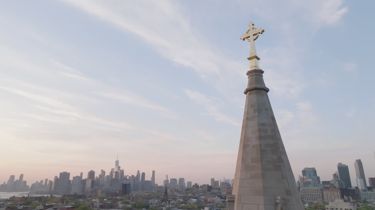 Aerial view of a crucifix on top of a church steeple in New York City