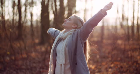 Smog-Concept-Young-Woman-Breathing-Fresh-Air-In-Forest-2