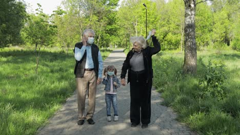 family of grandparents takes off medical masks after coronavirus quarantine end