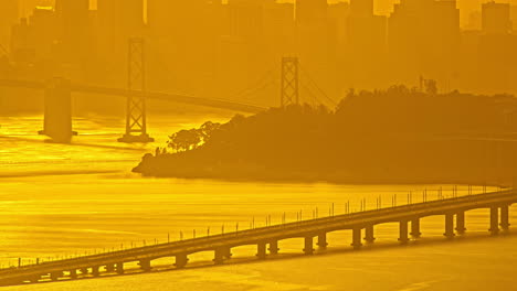 timelapse, traffic on oakland bridge above san francisco bay on hot summer day