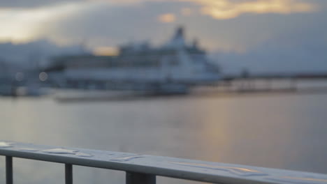 Tracking-shot-of-a-wet-railing-at-the-sea-port-and-marina-of-Ponta-Delgada-on-the-island-of-Sao-Miguel-of-the-Portuguese-Azores