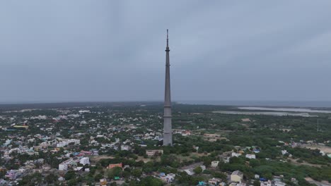 an aerial video of the rameswaram tv tower would offer a unique perspective of this engineering marvel. the camera would capture the tower's imposing height, rising above the surrounding landscape.