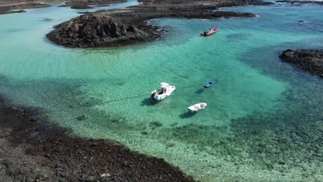 sensational crystal clear waters with floating boats shot with drone in 4k