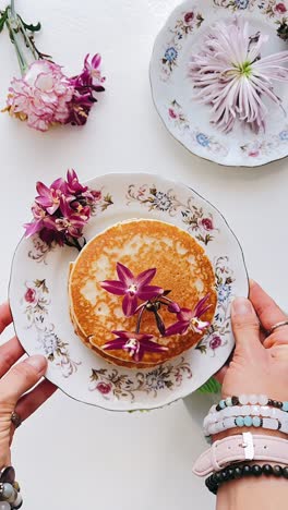 beautiful breakfast display with pancakes and flowers