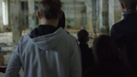young friends in abandoned building
