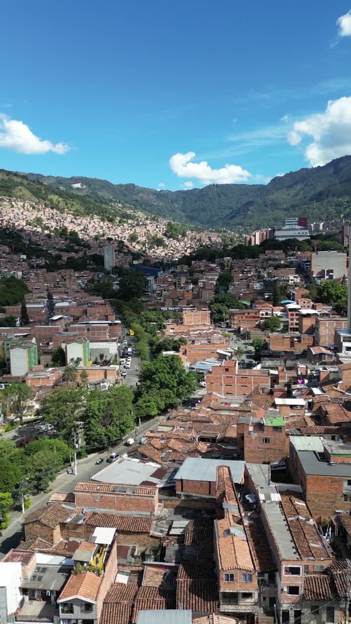 Experience Medellín, Colombia, through an aerial view capturing its vibrant cityscape, surrounded by the majestic Andes Mountains and lush greenery. Perfect for cultural and travel-focused projects.