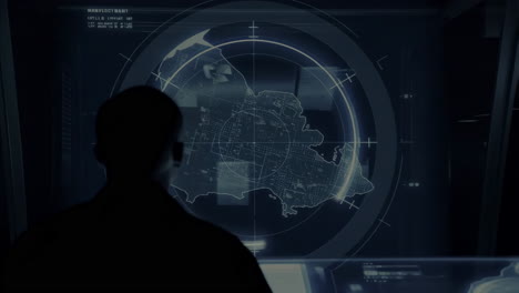 operator monitoring a digital map with radar in a control room