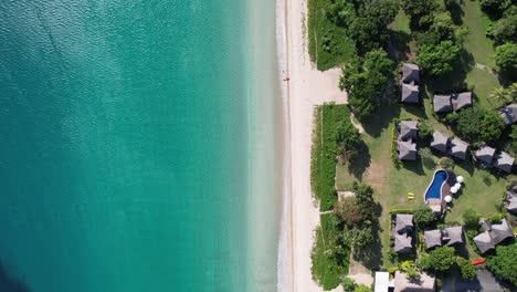 drone looking down flying over natadola beach in fiji on a sunny clear day