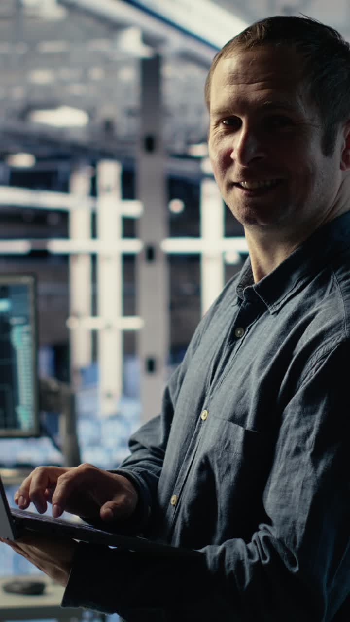 Vertical Video Engineer In Data Center Checks Ai Dashboard Using Laptop During Systems Review