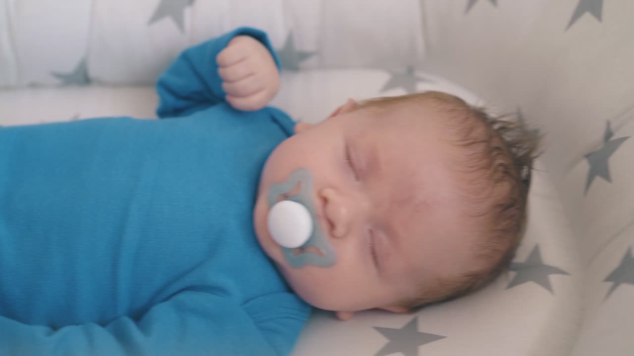 mommy rocks cot with newborn child sleeping in soft cocoon