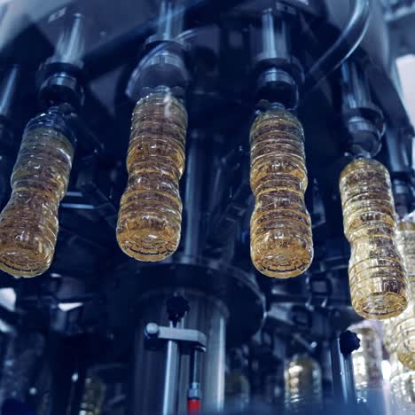 automated oil bottle filling in a factory