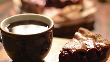 a cozy moment of indulgence: enjoying a slice of delicious cherry pie paired with a comforting cup of rich coffee on a rustic wooden table