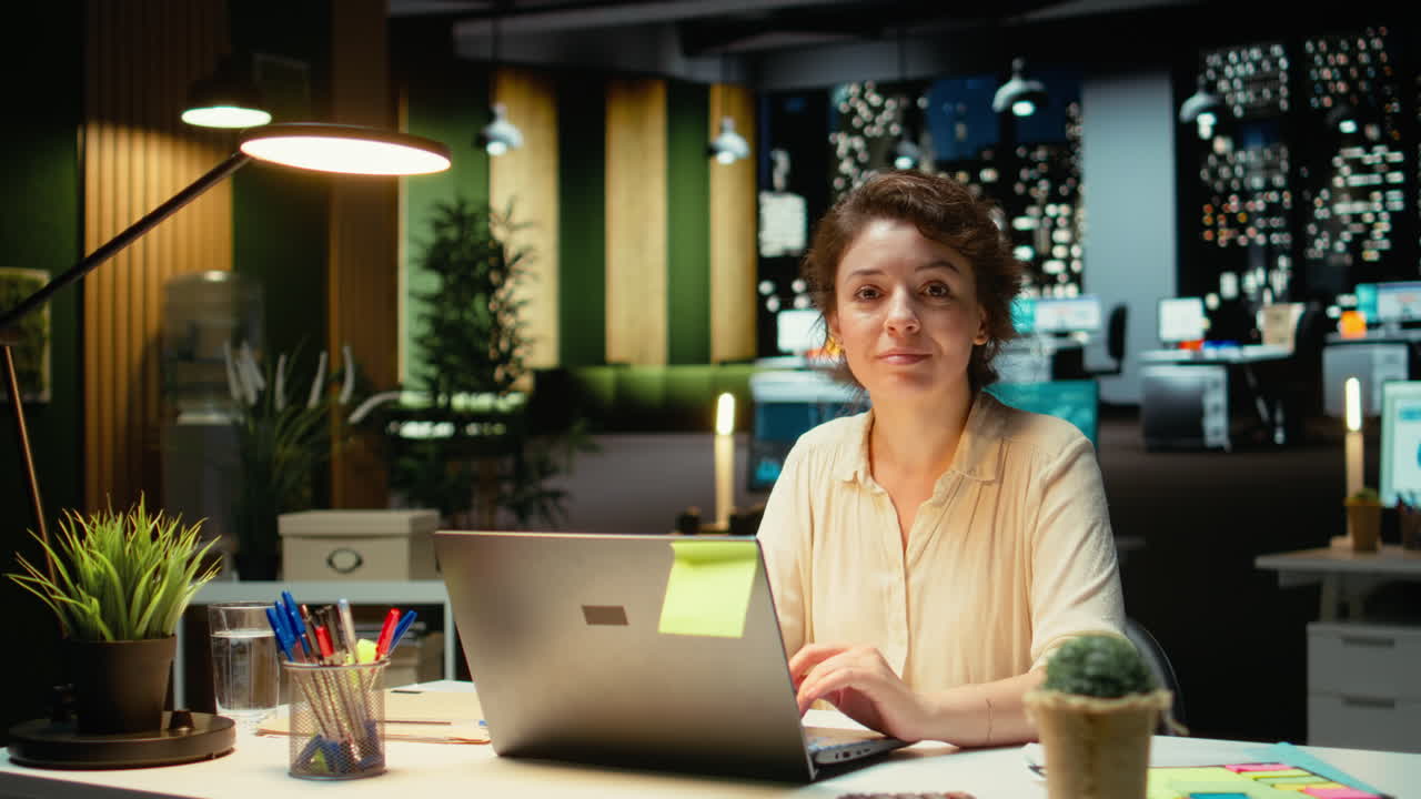 Vertical Video Businesswoman at night time reading finance data and proofreading reports