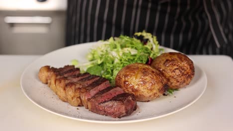 chef preparing a steak dinner