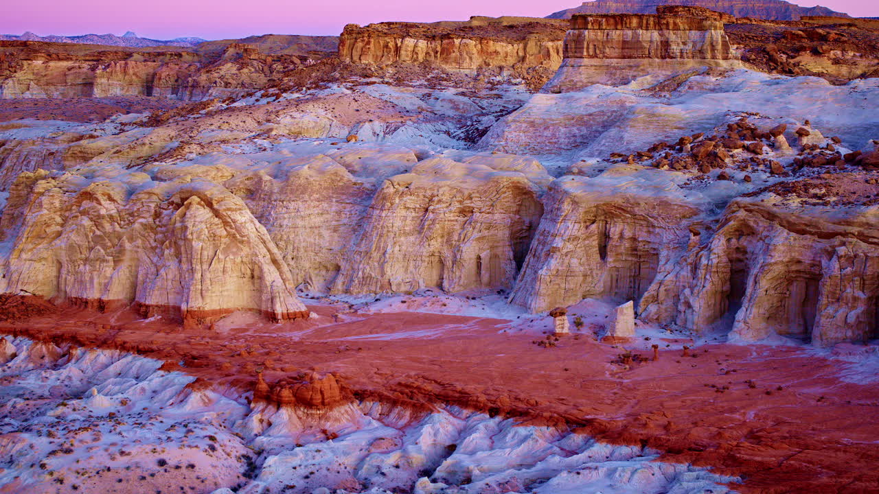 Slowly sweeping drone footage reveals the striking rock formations and multi-colored hills near the Utah-Arizona border.