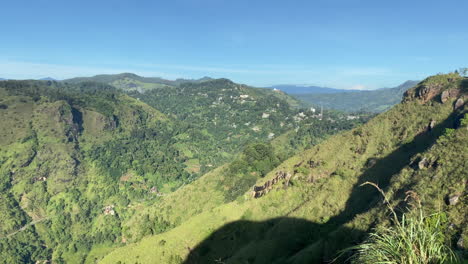 establishing handheld shot from little adam's peak in ella sri lanka on sunny morning