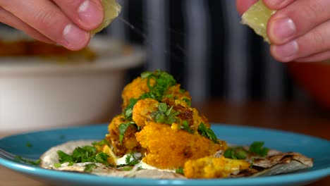 Man-Chef-squeezing-limes-on-top-of-the-most-delicious-cauliflower-tacos