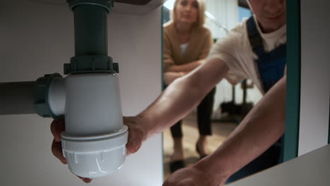 plumber fixing water pipes