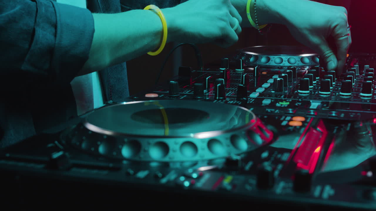 DJ with mixer at the disco