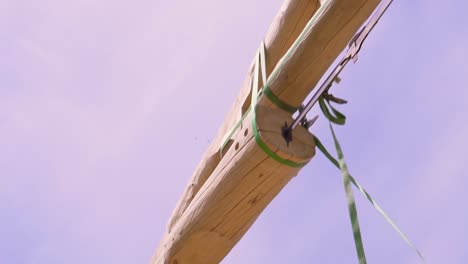 wooden beam lifting during construction