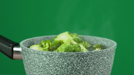 Fresh broccoli cooked in a saucepan.