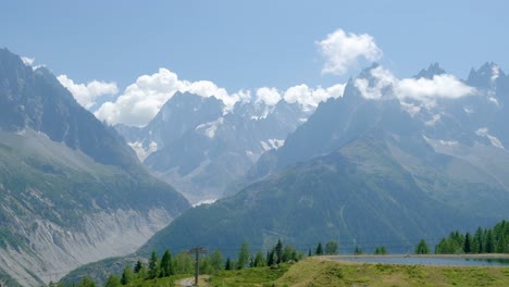 view of grand montets and a lake in a sunny day with natural light