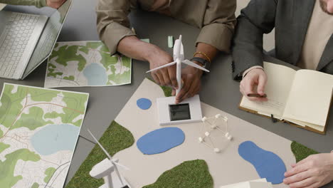 Top-View-Of-A-Multiethnic-Business-Team-Discussing-About-Renewable-Energy-Project-In-The-Office-2