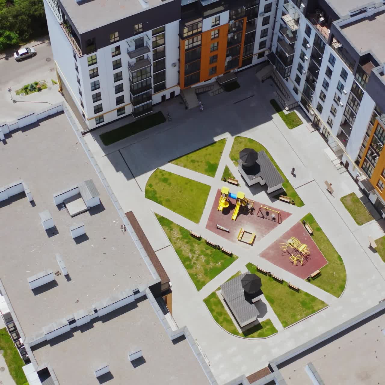 Modern building of residential complex. Aerial drone view over apartment blocks in city