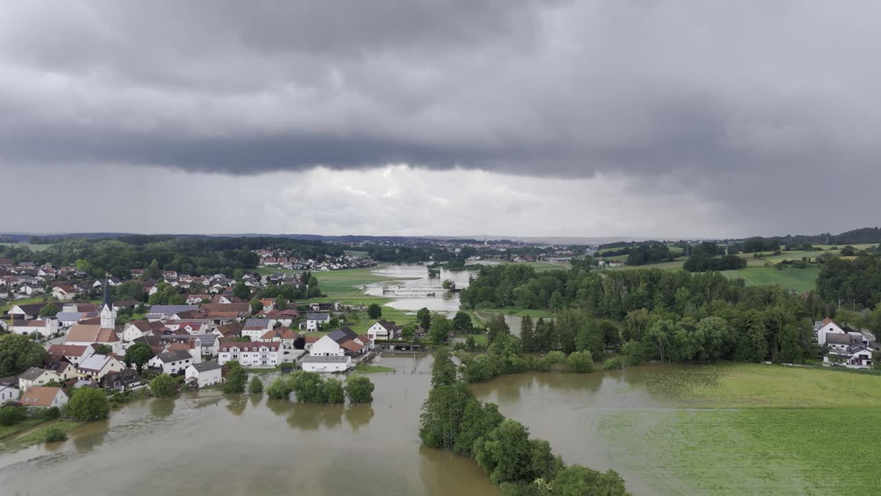 Fly towards Pfaffenhofen over flooded Ilm during high water 2024 in Germany, Bavaria.