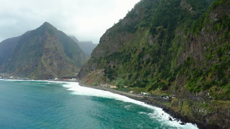 beautiful cloudy mountain coast landscape madeira with waves panoramic sky ocean, beach drone shot