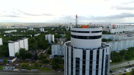 modern city with houses and round tower on foreground