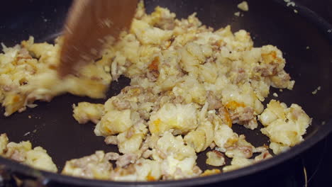 Ham-and-cheese-pasta-scramble-is-stirred-in-a-hot-non-stick-skillet